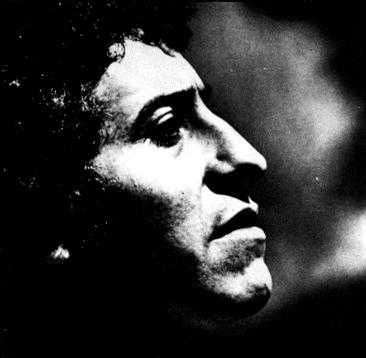 A black and white photograph of Victor Jara